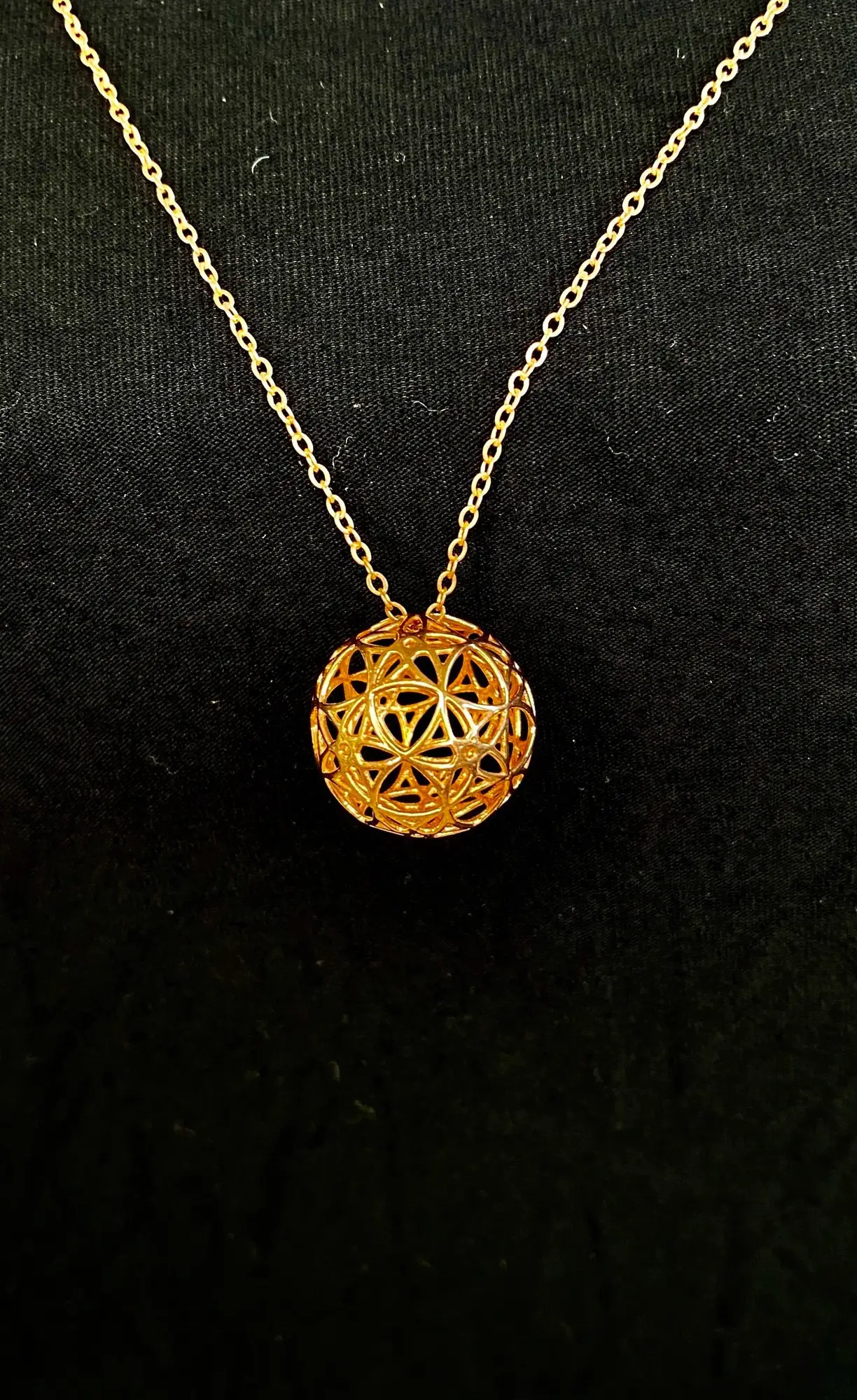 Copper AllSphyr pendant on a copper chain, front view