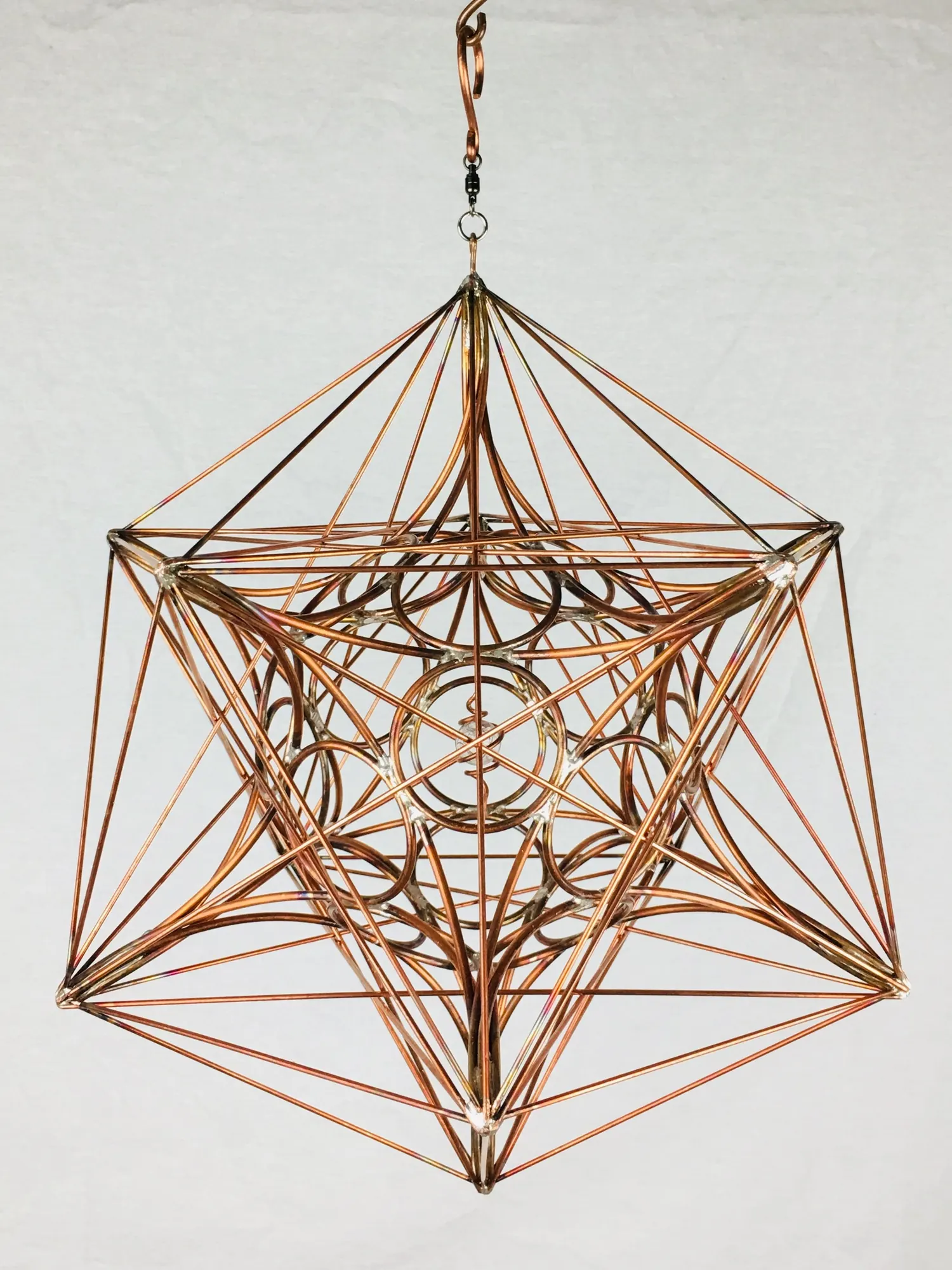 Metatron's Cube hanging copper sculpture viewed from a lower angle