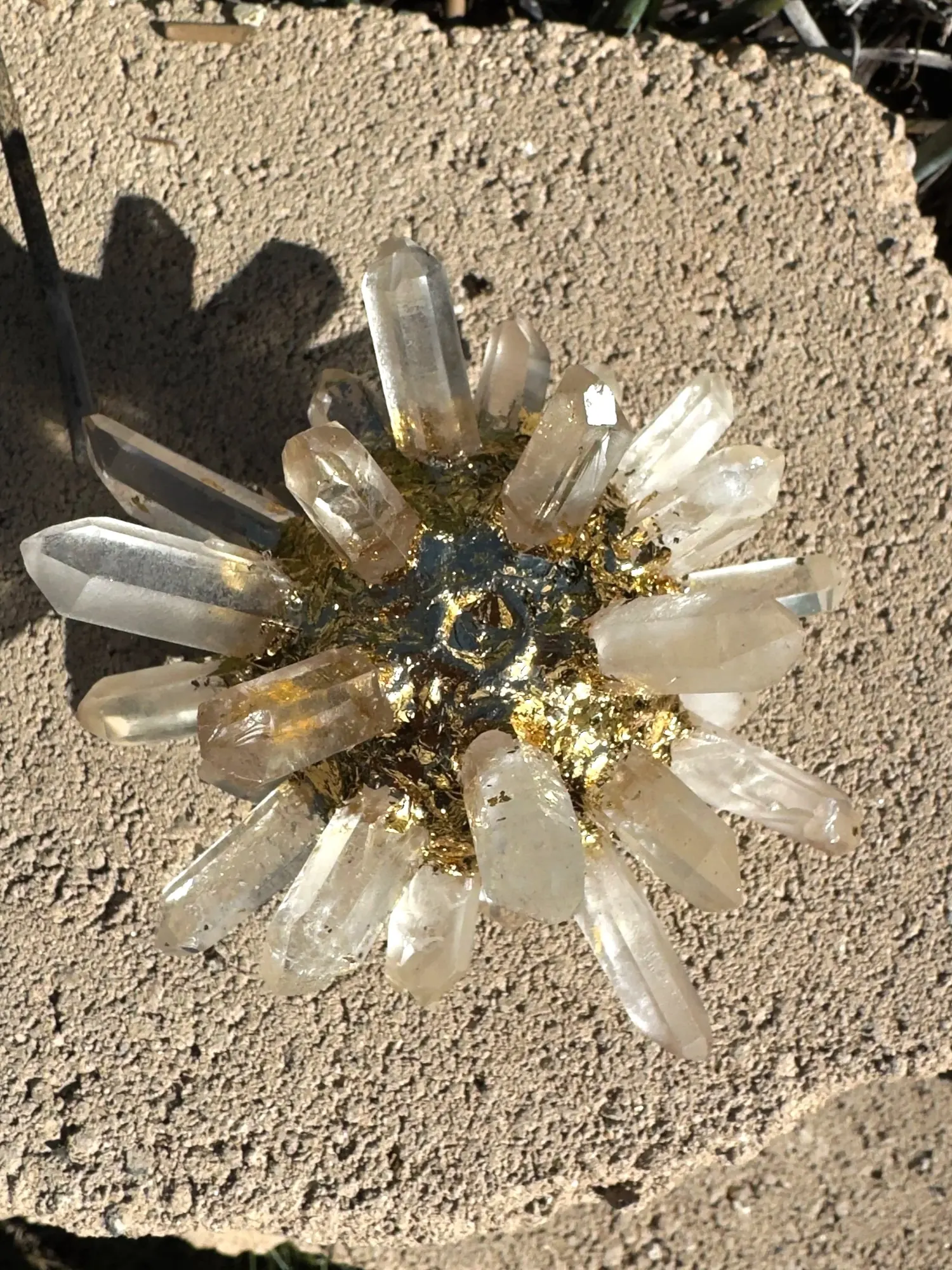Quartz Crystal AllSphyr viewed from above on a concrete surface