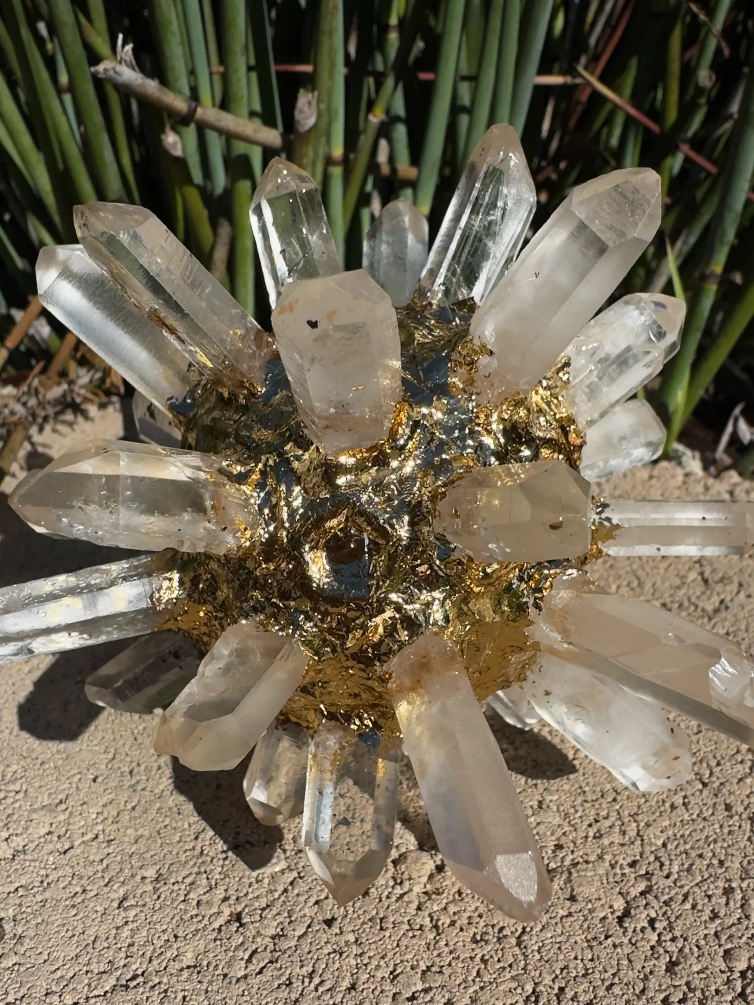 Quartz Crystal AllSphyr with its gold-gilded center catching afternoon light